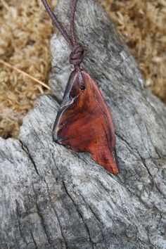 With a beautiful live rough edge and adorned with a stunning handmade blue ceramic raku bead,  this unique Irish Bog Yew necklace is a one-off piece. Bog-wood comes from ancient forests that once covered Ireland. Huge oaks and yew trees have been buried in peat bogs and preserved from decay by the acidic and anaerobic bog conditions, sometimes for hundreds or even thousands of years. The wood is usually stained by tannin dissolved in the acidic water (black for the oak and a lovely purpely brown Nature-inspired Brown Carved Jewelry, Brown Carved Nature-inspired Jewelry, Nature-inspired Brown Wood Jewelry, Nature-inspired Brown Wooden Jewelry, Brown Wooden Nature-inspired Jewelry, Celtic Knot Necklace, Sacred Tree, Old Irish, Ancient Forest