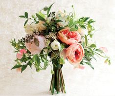 a bouquet of flowers sitting on top of a table