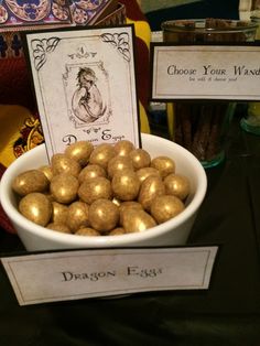 a bowl filled with chocolate eggs sitting on top of a table next to other items