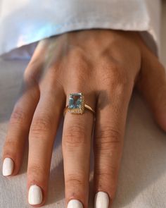 DetailsMaterial: 14k/18k goldColor Options: Yellow Gold, White Gold, Rose Gold★ Center StoneAquamarine, OctagonSize: 7.30 x 9.85mmApprox Weight (Ct): 2.9★ Accent StonesDiamond RoundSize: 1.3 mm * 26 Nos.Approx Weight (Ct): 0.182 Emerald Cut Aquamarine Rings With Gemstone Accents, Yellow Gold Aquamarine Ring With Gemstone Accents, Yellow Gold Aquamarine Rings With Gemstone Accents, Future Engagement Rings, Aquamarine Engagement Ring, Natural Gemstone Jewelry, Aquamarine Ring, 18k Gold Ring, Aquamarine Rings