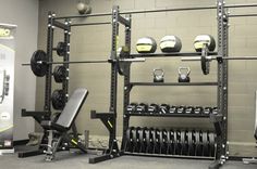 the gym equipment is neatly organized and ready to be used for training or as an exercise center