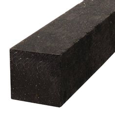 a block of black granite sitting on top of a white surface