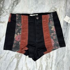 New With Tags. Gorgeous With A Free High-Rise, Patchwork Denim Shorts Features Brown Corduroy And Floral Print Over Black Denim. Fabric Content Is 93% Cotton, 5% Polyester, And 2% Elastin. Measurements Are As Follows: 14 Inches Across At The Waist, 11 Inch Rise, And 17 Inches Across At The Hips. All Measurements Are Approximate And Taken While Laying Flat. Patchwork Shorts Outfit, Black High Waist Jean Shorts For Fall, Fitted Brown Bottoms With Patchwork, Fitted Brown Patchwork Bottoms, Black Cotton Shorts For Fall, Black Patchwork Short Bottoms, Black Patchwork Shorts, Circus Shorts, Upcycled Shorts