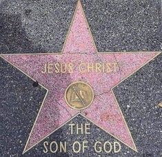 a star on the hollywood walk of fame with jesus christ written in gold and pink