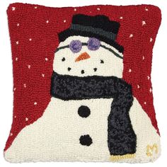 a pillow with a snowman on it