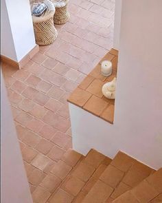 an aerial view of a tiled floor and stairs