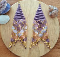 Beautiful long dangle fringe mermaid tail earrings. Aboslutely mermaidcore. A true statement jewelry. Mermaid Seed Bead Earrings, Ocean Mermaid, Beautiful Beaded Earring, Jewelry Purple, Beaded Earring, Mermaid Earrings, Beaded Fringe, Mermaid Tail, Bead Jewelry