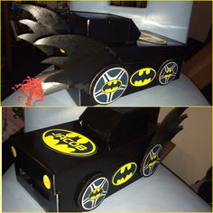 the batman cake is made to look like it's coming out of a box