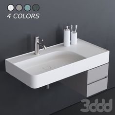 a white bathroom sink sitting on top of a counter next to a wall mounted faucet