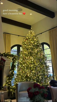 a living room with a large christmas tree in the center and presents on the floor