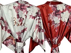 two robes with flowers on them and the bride's name written on one side