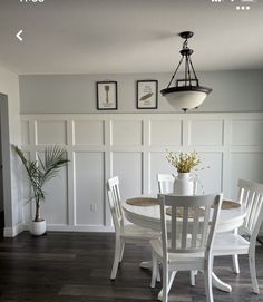 a white table and chairs in a room