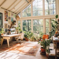 a living room filled with furniture and lots of windows covered in plants on top of them