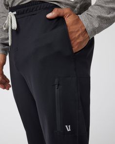 A fresh take on athleisure and a staple in your wardrobe, the Sunday Performance Joggers are premier in fit, function and soft stretch. This jogger style will keep you moving with less bulk around your ankles. | Vuori Sunday Performance Jogger Pants | Black | Medium Vuori makes premium performance apparel inspired by the active Coastal California lifestyle; an integration of fitness, surf, sport, and art. Breaking down the boundaries of traditional activewear, we are a new perspective on perform Black Comfort Stretch Joggers For Jogging, Black Comfortable Stretch Sporty Joggers, Sporty Black 4-way Stretch Sweatpants, Black Comfort Stretch Joggers, Black 4-way Stretch Joggers For Jogging, Midweight Athleisure Pants For Workout, Athleisure Sweatpants With Functional Drawstring For Workout, Black Comfort Stretch Joggers For Sports, Athleisure Activewear With Functional Drawstring For Jogging