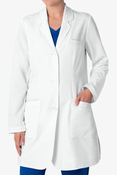 Our Healing Hands 5101 Women’s Modernist Fiona White Lab Coat provides a sophisticated silhouette thanks to front and back darts, plus an adjustable back belt. Finding the right white coat is a confidence builder, and our Healing Hands White Lab Coat collection is here to help you with two flattering options—the minimalist, and modernist. • Modern classic fit • Rounded notch collar • 3-button closure • Plastic buttons • Total of 4 pockets • 1 left chest welt pocket • 2 front angled patch pockets Medical Scrubs Fashion, Yoga Scrub Pants, Healing Hands Scrubs, White Lab Coat, Medical Scrubs Outfit, Medical Lab, Scrubs Outfit, Uniform Advantage, Lab Coats