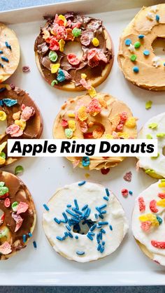 a box filled with lots of different flavored doughnuts covered in sprinkles