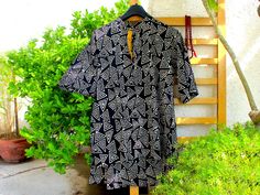 Shop our beautiful store at www.VedahDesigns.com Black block print men's kurta or top in breathable soft cotton. Block print kurta with a placket of yellow kantha fabric. Wooden buttons on the placket. Two side pockets. Color - Black, yellow, and white. Customization is available. We welcome wholesale orders as well. You may also choose any fabric from our fabric section and get it made in your size. Wash Care Instructions:- Gentle hand wash in cold water and dry in the shade. Shipping Information: The processing time for international/ domestic orders is 1 to 2 weeks for custom orders. Delivery time for international orders - 10 to 15 days. Delivery time of domestic orders would be 2 to 4 days. If you want to see more men's wear, please click the link below:- https://www.etsy.com/in-en/sh Black Printed Cotton Kurta, Black Block Print Cotton Tops, Kurta For Men, Men's Kurta, Kantha Fabric, Men In Black, Bright Patterns, Custom Jacket, Wooden Buttons