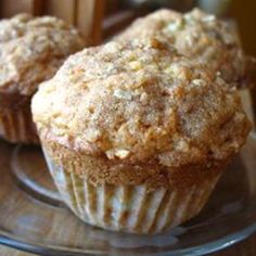 two muffins sitting on top of a glass plate