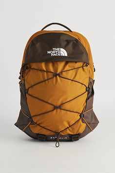 Backpack by The North Face ready for the outdoors. Features zip pockets with a stretching webbing to the front. Adorned with a logo accent. Fitted with a top carry handle, adjustable shoulder straps & belt closure. Features Outdoor-ready backpack from The North Face Zippered pockets & stretch webbing Ideal for school, hiking or travel Adjustable shoulder straps Content + Care Recycled polyester Spot clean Imported Size Dimensions: 12" w x 6.5" d x 19.5" h | The North Face Borealis Backpack in Taupe at Urban Outfitters North Face Backpack School, North Face Borealis Backpack, Backpacking Outfits, Borealis Backpack, The North Face Borealis, Cute Hiking Outfit, North Face Borealis, Inktober 2024, 2024 Christmas