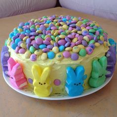 an easter cake decorated with peep holes and candy