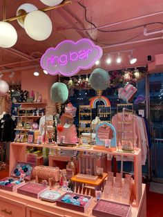 a pink store with lots of items on display