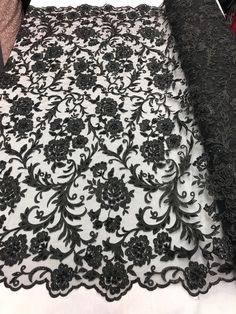 black and white lace with flowers on it