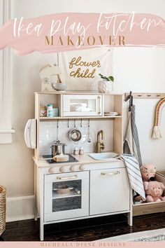 a white kitchen with pink and gold accents