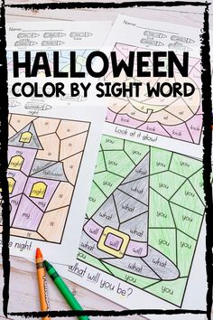 halloween color by sight worksheet with pencils and crayons on the table