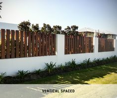 a white fence with wooden slats on it