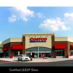 the exterior of a costco store with cars parked in front