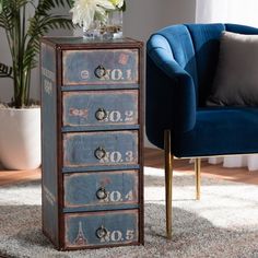 a blue chair sitting next to an old dresser