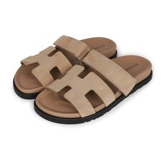 This pair of Cypre sandals are in beige suede and feature the iconic H and a velcro crossover strap. Origin: ItalyCondition: Pristine; new or never wornAccompanied by: Hermes box, dustbagsSize: 37 EU Hermes Sandals, New Taiwan Dollar, Hermes Box, Gold Ounce, Madison Avenue, Flat Sandals, Crossover, Dubai, Ootd