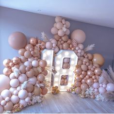 a room with balloons and letters on the wall