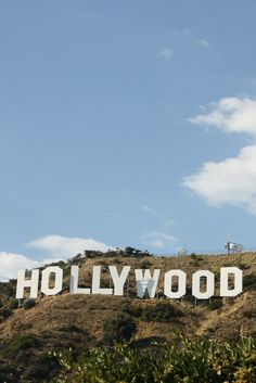 the hollywood sign is on top of a hill