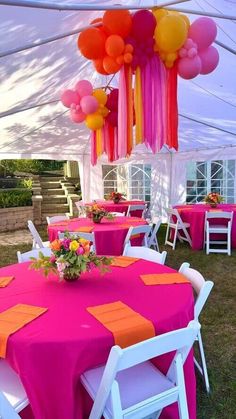 an outdoor tent with tables and chairs covered in pink, orange and yellow tablecloths