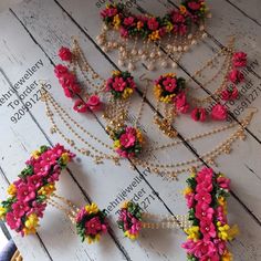 flowers and pearls are laid out on a table