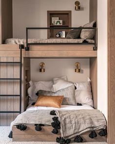 a bunk bed with two sets of pillows on it