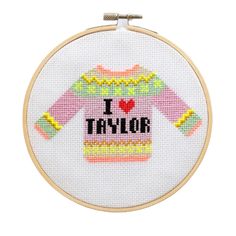 i love taylor cross stitch pattern on a white hoop with the word taylor written in black