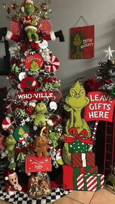 the grinch christmas tree is decorated in red and green