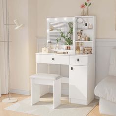 a bedroom with a bed, desk and mirror