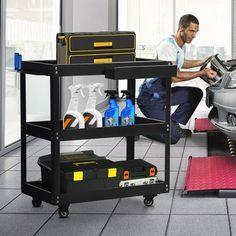 a man working on a car in a garage