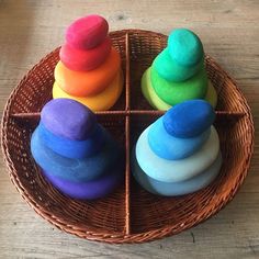 four different colored play doughs in a wicker basket