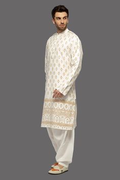 Ivory straight kurta with floral print. Paired with a salwar. - Aza Fashions Transitional Straight Kurta Salwar Kameez With Printed Motifs, Transitional Salwar Kameez With Printed Motifs, Off White Straight Kurta With Printed Motifs, Traditional Palazzo Set With Printed Motifs And Straight Kurta, Designer Cream Kurta With Printed Motifs, Unstitched Cream Kurta With Printed Motifs, Designer White Salwar Kameez With Naqshi Detailing, Designer White Salwar Kameez With Naqshi, Designer White Naqshi Salwar Kameez