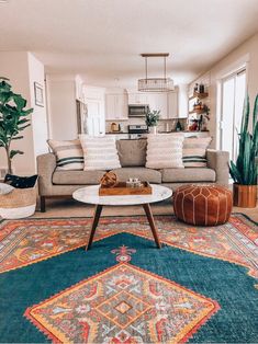 a living room filled with furniture and rugs