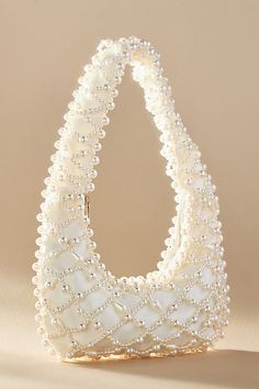 Find ANTHROPOLOGIE Lucy Satin Pearl Handbag on Editorialist. The Anthropologie Lucy Satin Pearl Handbag is crafted from polyester and plastic and features a beaded design. It can be worn on the shoulder. Pearl Handbag, Anthropologie Wedding, Bridal Bag, Swarovski Bracelet, Candles For Sale, White Purses, Bride Bridal, Bridal Gifts