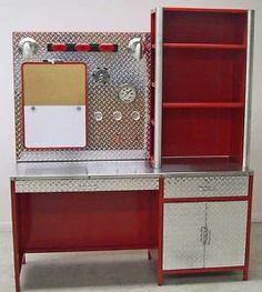 a red and white fireman's desk with cabinets on wheels is shown in front of a white wall