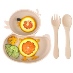 two plates with oranges and cucumbers on them, one has a fork