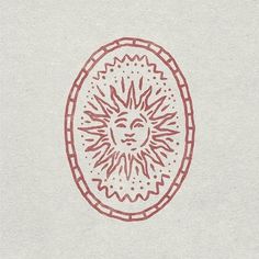 a drawing of a sun in the middle of a circle with red lines on it