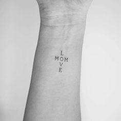 a woman's arm with the words i love mom on it