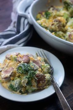 a white plate topped with broccoli and ham casserole